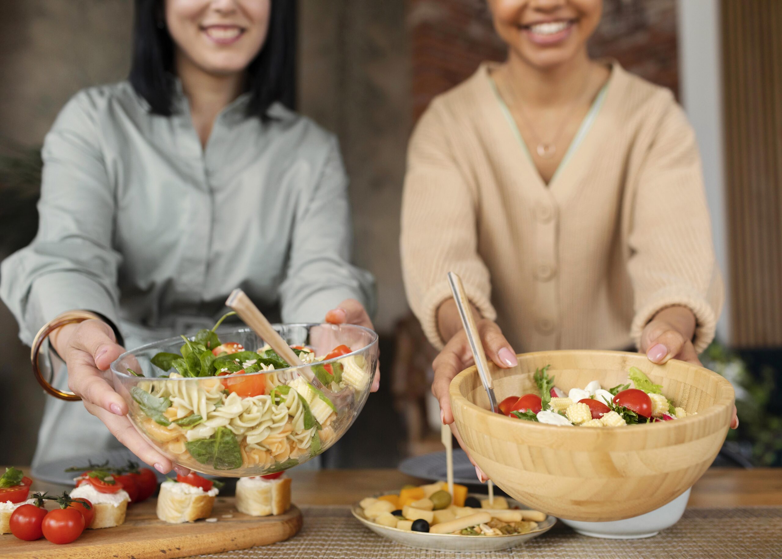 medium shot happy women holding bowls